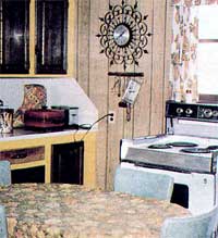 The clock, the range, the refrigerator/freezer, the table and even the chairs came from the country landfill.